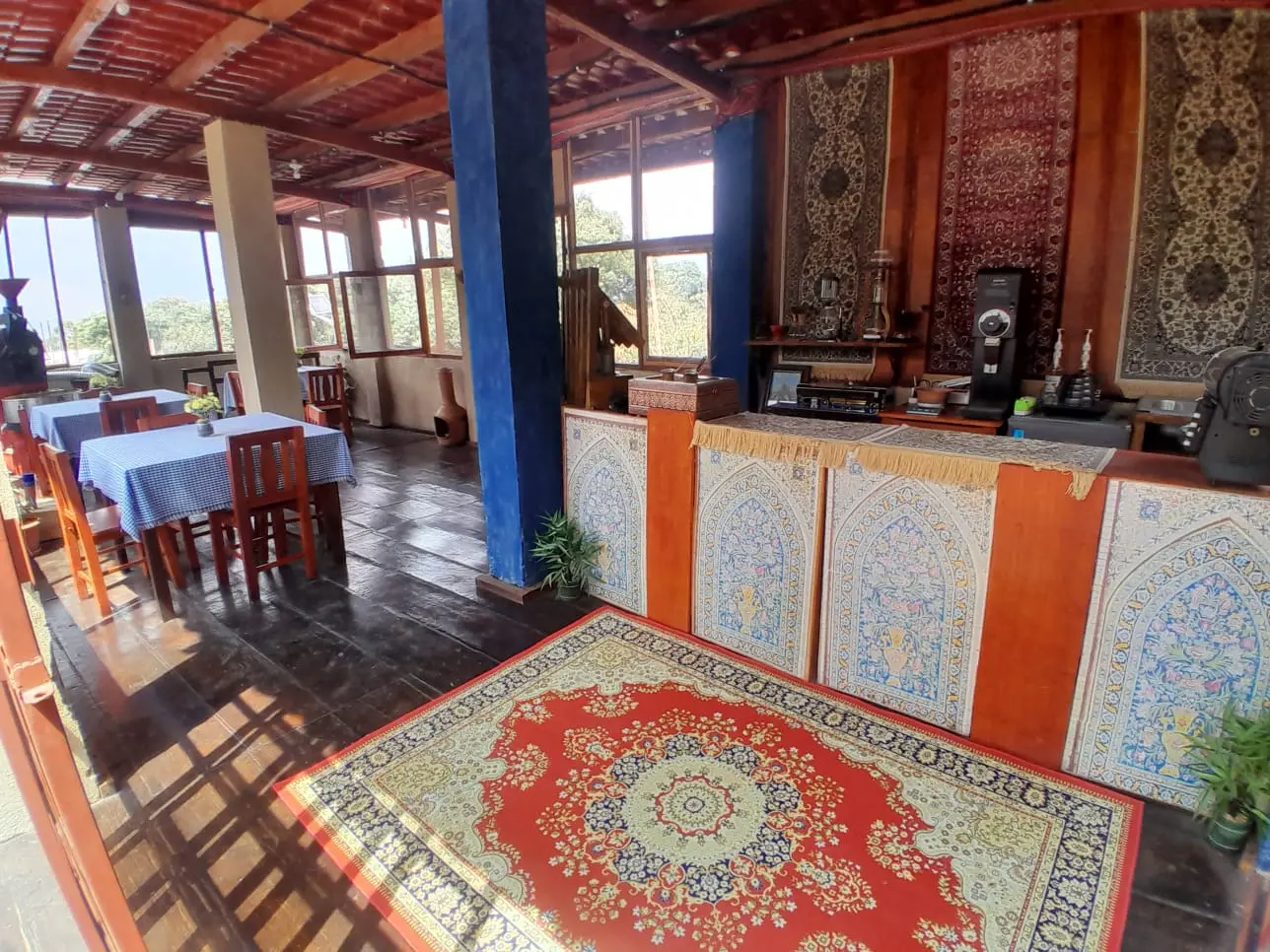 Cafeteria with Greek carpet decoration.